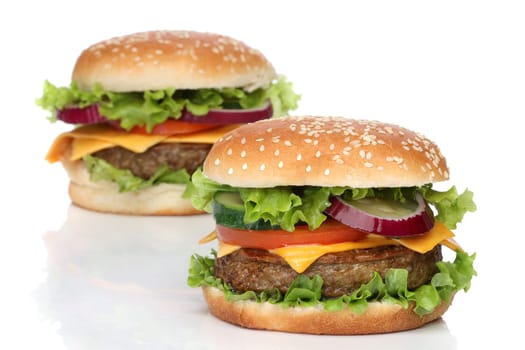 Two delicious hamburgers isolated on white background