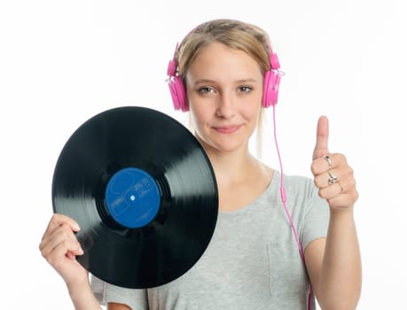 Blonde girl with headphones holds a record