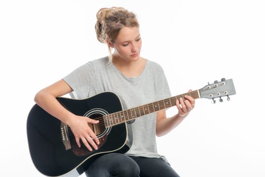 Blonde girl with a guitar