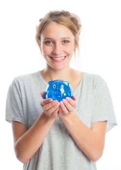 Blonde girl holds a piggy bank