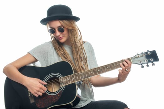 Blonde girl with hat and guitar