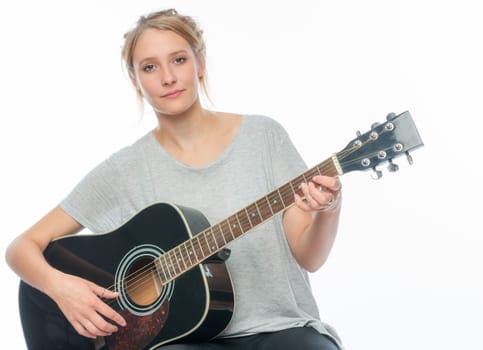 Blonde girl with a guitar