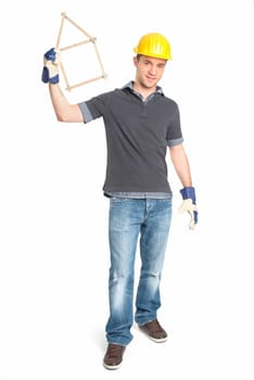 Young craftsman shows a customs stick in the form of a house