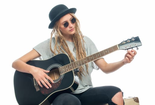 Blonde girl with hat and guitar