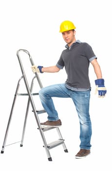 Young man with construction helmet and step ladder