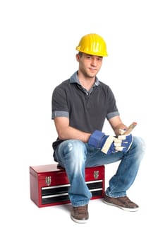 Young man sits on a tool case