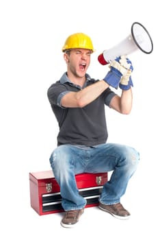 A craftsman sits on a toolbox and holds a megaphone