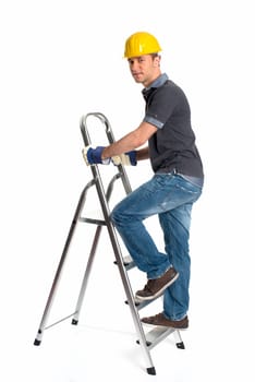 Young man with construction helmet and step ladder