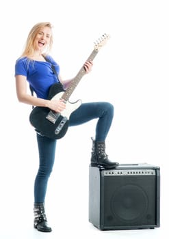 Blonde girl with guitar and amplifier