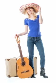 Blonde girl with suitcase and guitar