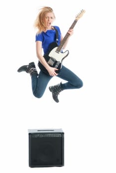 Blonde girl plays guitar and jumps up
