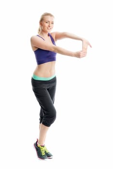 Blonde athlete does fitness exercises