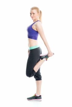 Blonde girl does fitness exercises