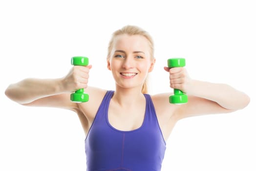 Blonde girl trained with dumbbells