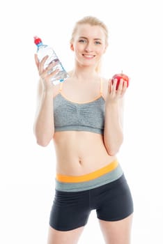 Blonde sportswoman with drink and fruit