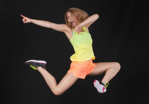 Blonde athlete takes a leap of joy