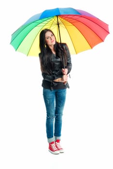 Young woman stands under an umbrella