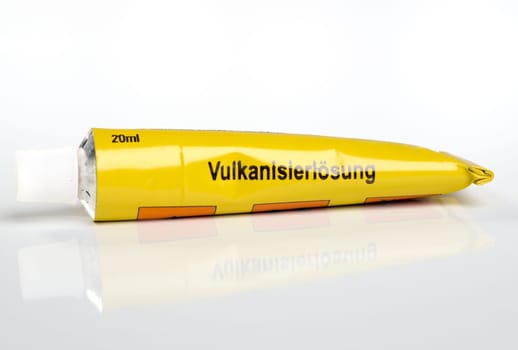 A yellow tube of glue