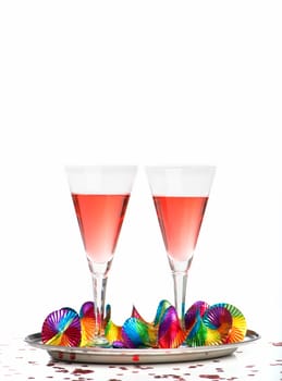 2 filled glasses of sparkling wine