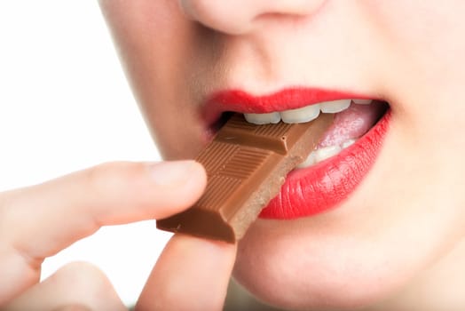 Woman's mouth eats chocolate