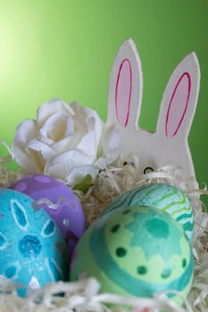 Easter eggs , flowers and funny bunny to celebrate Easter. Wallpaper for Easter announcements and cards.Vertical real picture, ideal for social media stories and postings