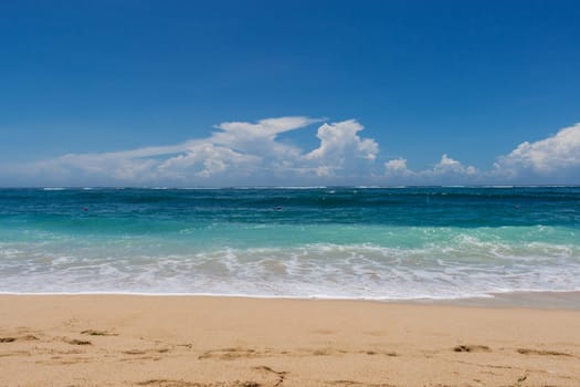 Beautiful secluded sandy beach in the Caribbean with white sand and blue sky as in paradise