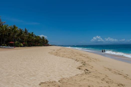 Beautiful secluded sandy beach in the Caribbean with white sand and blue sky as in paradise