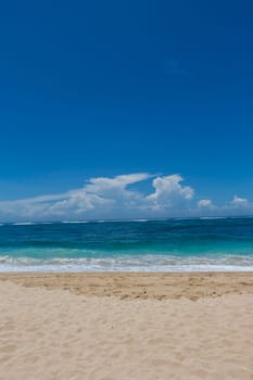 Beautiful secluded sandy beach in the Caribbean with white sand and blue sky as in paradise