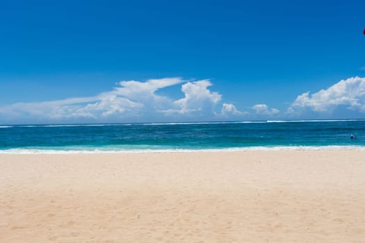 Beautiful secluded sandy beach in the Caribbean with white sand and blue sky as in paradise