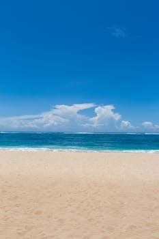 Beautiful secluded sandy beach in the Caribbean with white sand and blue sky as in paradise