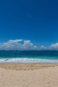 Beautiful secluded sandy beach in the Caribbean with white sand and blue sky as in paradise