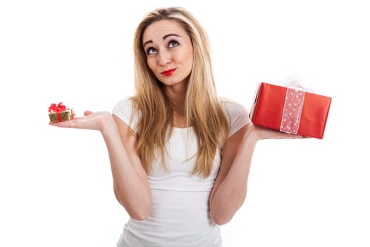 Young attractive woman with gifts rejoices and laughs isolated against white background