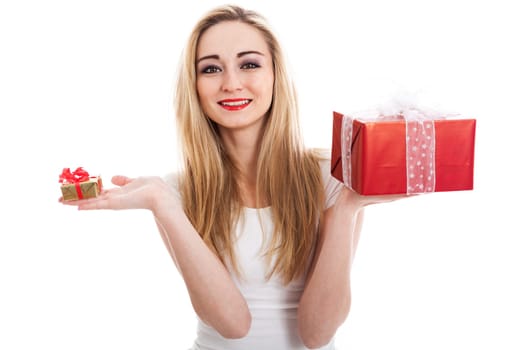 Young attractive woman with gifts rejoices and laughs isolated against white background