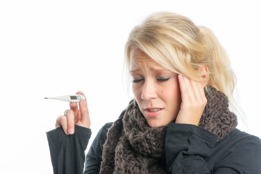 Sick woman with fever thermometer