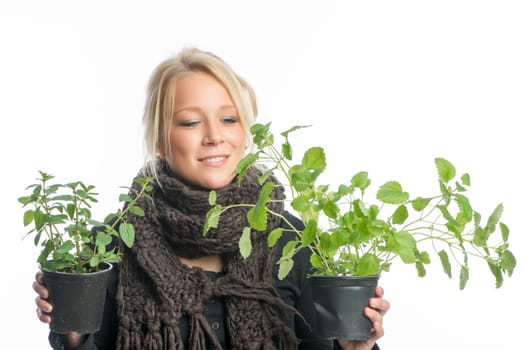 Blonde woman with medicinal plants