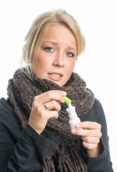 Cold woman with sniffle spray