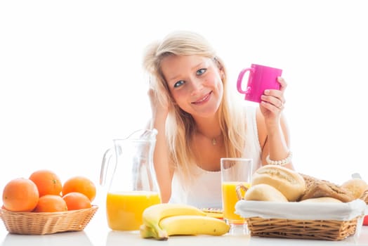 Blonde woman at the covered breakfast table