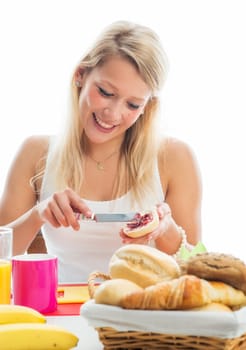 Blonde woman at the covered breakfast table