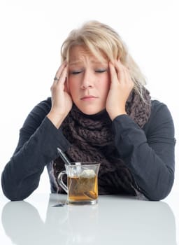 Sick woman drinks tea