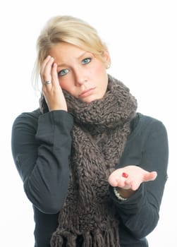 Sick blonde woman with medication