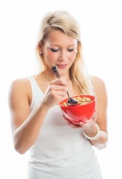 Blonde woman holds a breakfast bowl