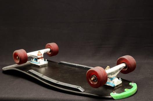 Vintage Style Black Skateboard on a black Background