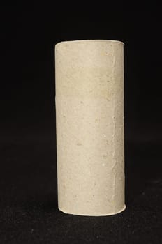 Empty Toilet Rolls Stack Up On a Black Background