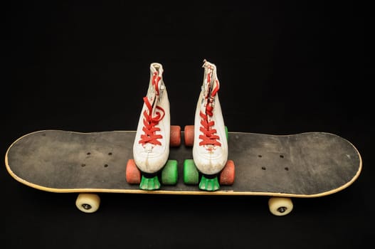 Vintage Style Black Skateboard and Skate Boot on a Dark Background