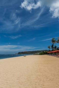 Beautiful secluded sandy beach in the Caribbean with white sand and blue sky as in paradise