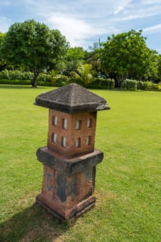 Artful carvings in stone stonemasonry in a green complex in Bali