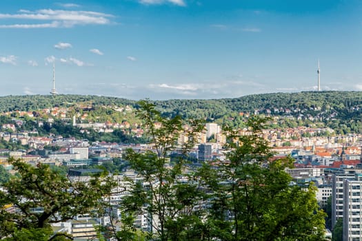 Picturesque view of Stuttgart Germany the modern skyscrapers under the traditional historical architecture overlooking the surrounding hills on a sunny day