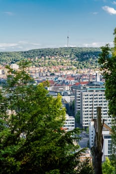 Picturesque view of Stuttgart Germany the modern skyscrapers under the traditional historical architecture overlooking the surrounding hills on a sunny day
