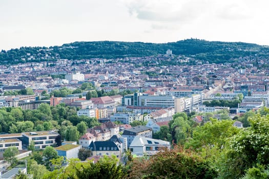 Picturesque view of Stuttgart Germany the modern skyscrapers under the traditional historical architecture overlooking the surrounding hills on a sunny day