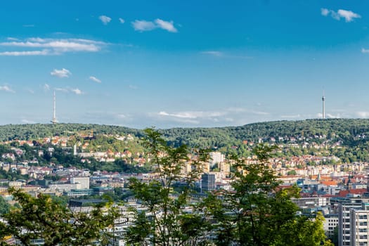 Picturesque view of Stuttgart Germany the modern skyscrapers under the traditional historical architecture overlooking the surrounding hills on a sunny day